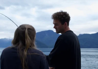 Justin showing a guest his fishing technique