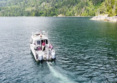 Aluminum fishing guide boat headed out to sea