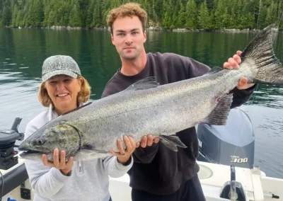 Justin and a woman showing off a record catch