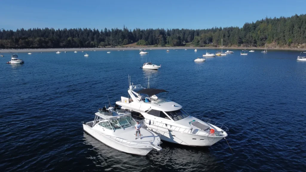 Campbell River Fishing Guide boat alongside a small yacht