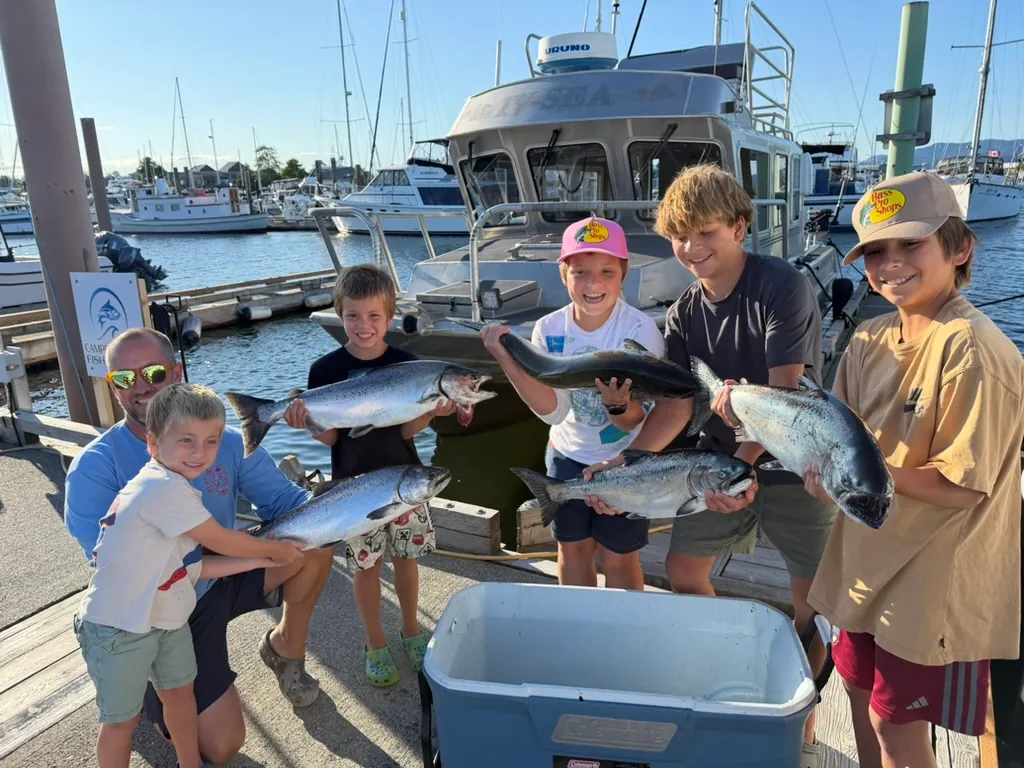 Group of young boys showing off their catch with Campbell River Fishing Guide